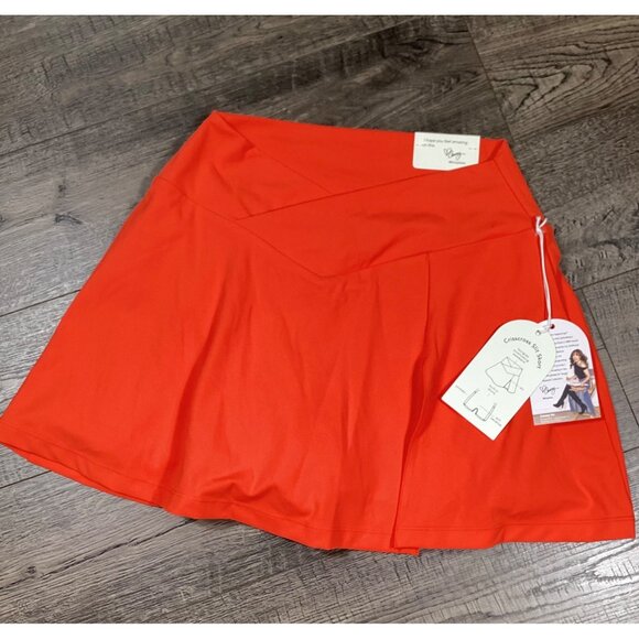 BLogilates Womens Crisscross Spicy Orange Slid Skort Size M Pockets Gymwear NEW - Picture 1 of 8